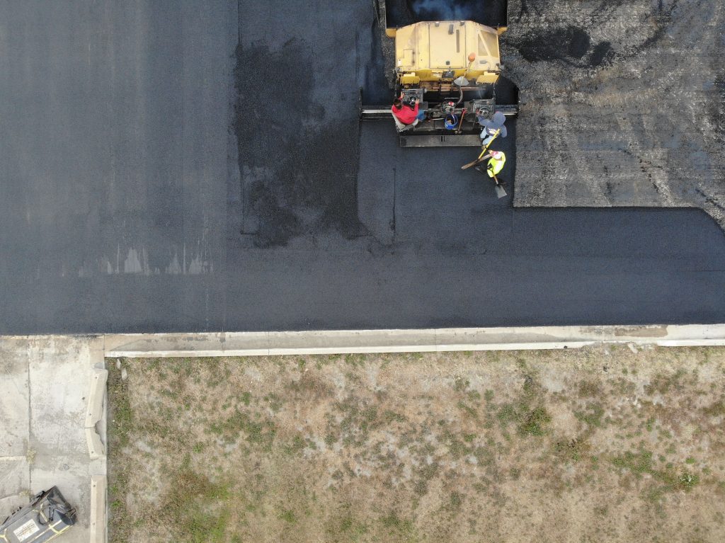 When to Choose a Commercial Asphalt Overlay vs. Full Repaving